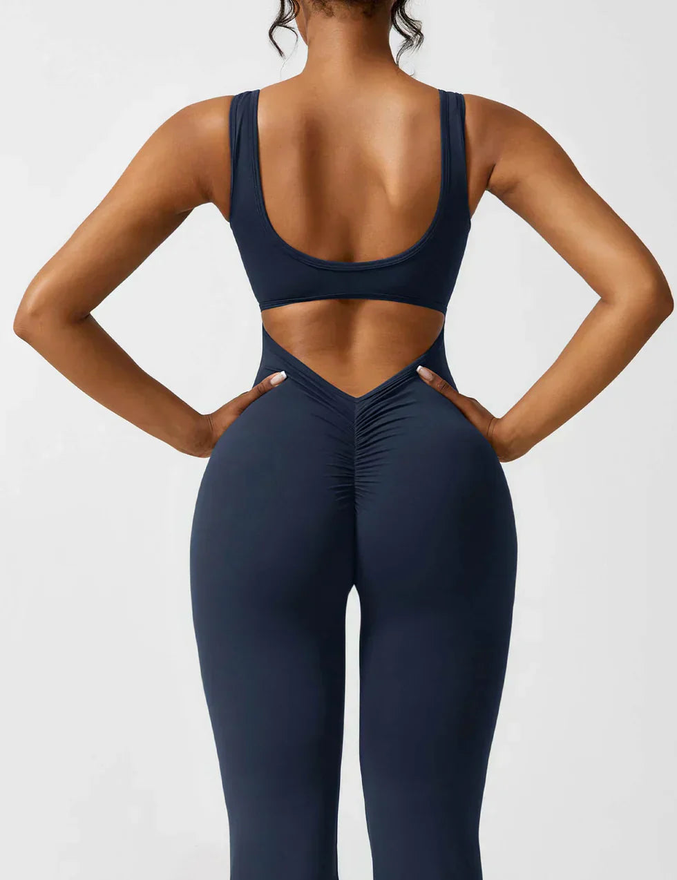 OMNIYA™ | Tuta Flared con V-Scollo